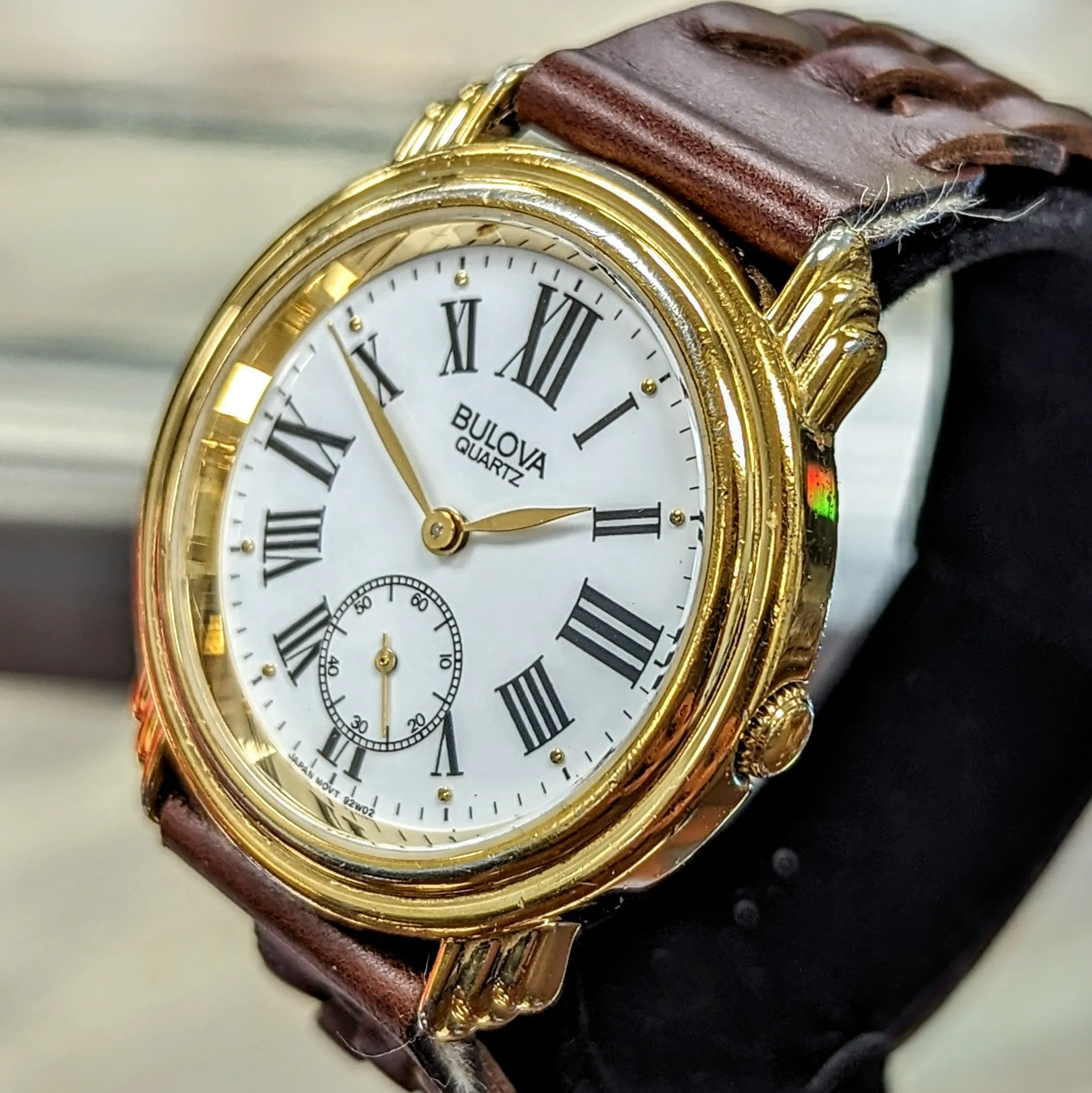 1991 BULOVA Roman Numerals Watch Round Case & Fancy Lugs Quartz Wristwatch