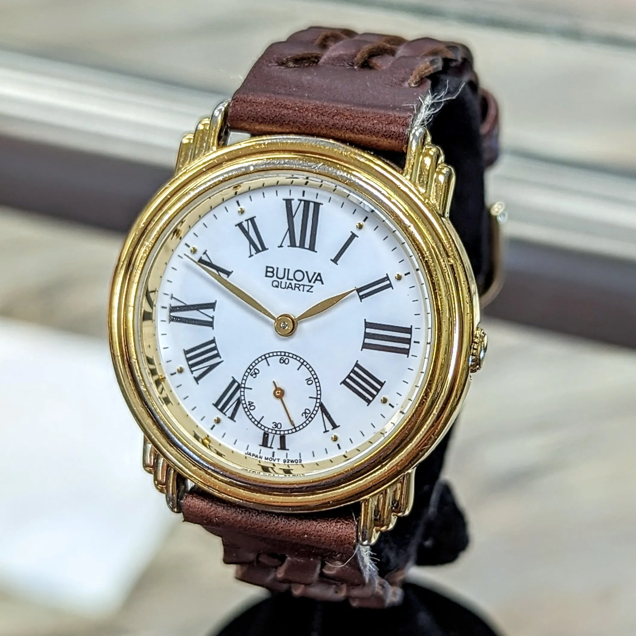 1991 BULOVA Roman Numerals Watch Round Case & Fancy Lugs Quartz Wristwatch