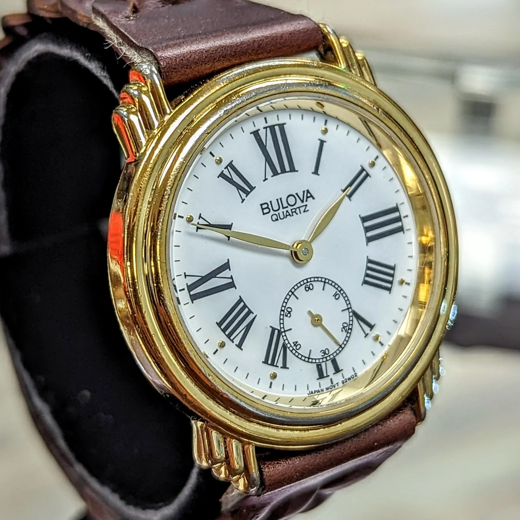 1991 BULOVA Roman Numerals Watch Round Case & Fancy Lugs Quartz Wristwatch